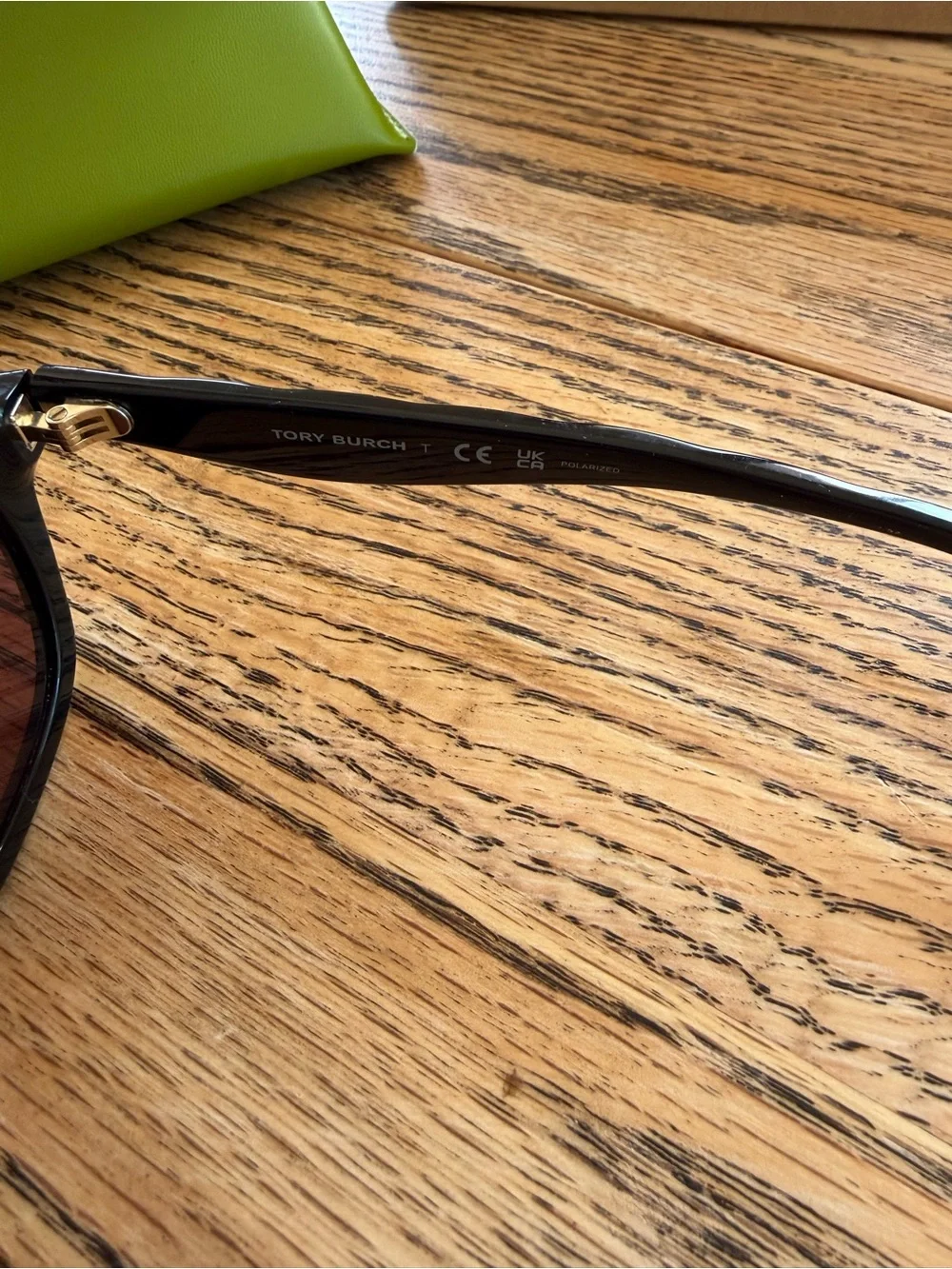 Tory Burch Black Frame Sunglasses with Violet Polarized Lenses